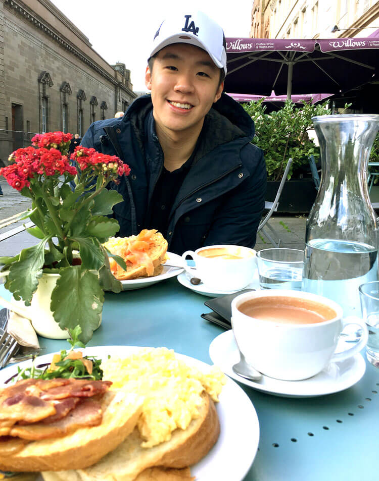 Photo of Nathan Ng enjoying a Scottish breakfast.