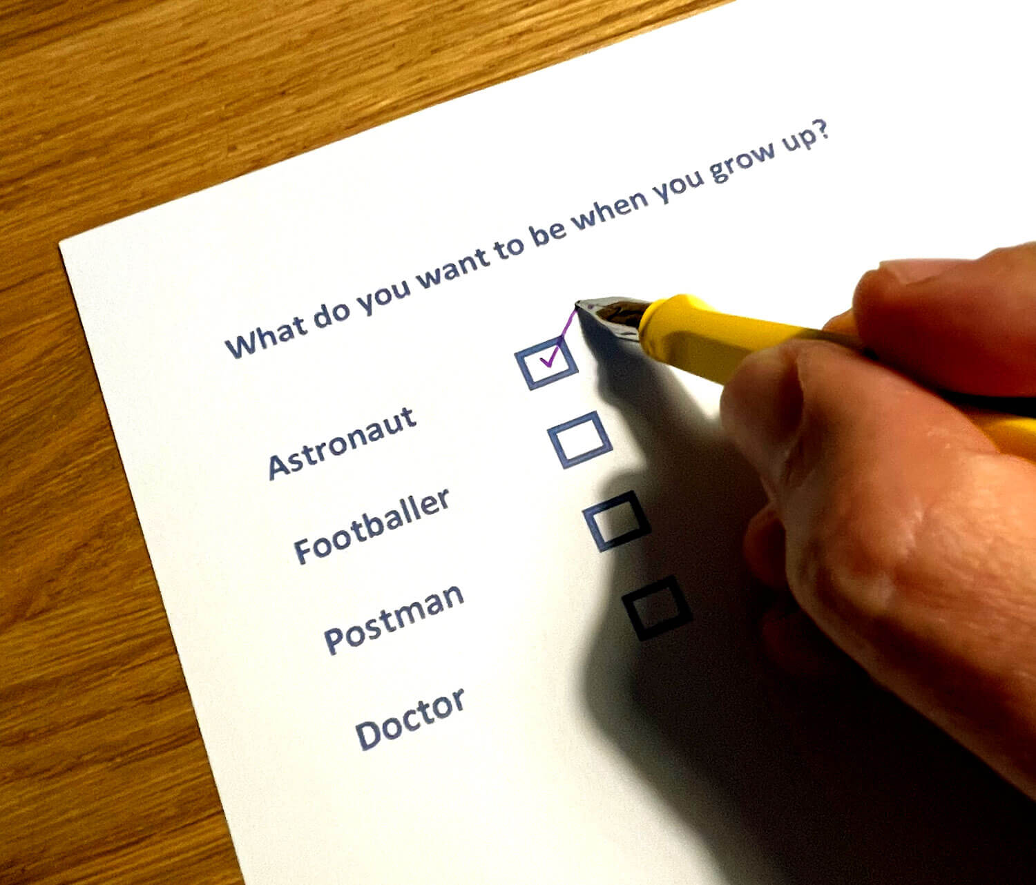 Photo of person ticking a multiple-choice box. 