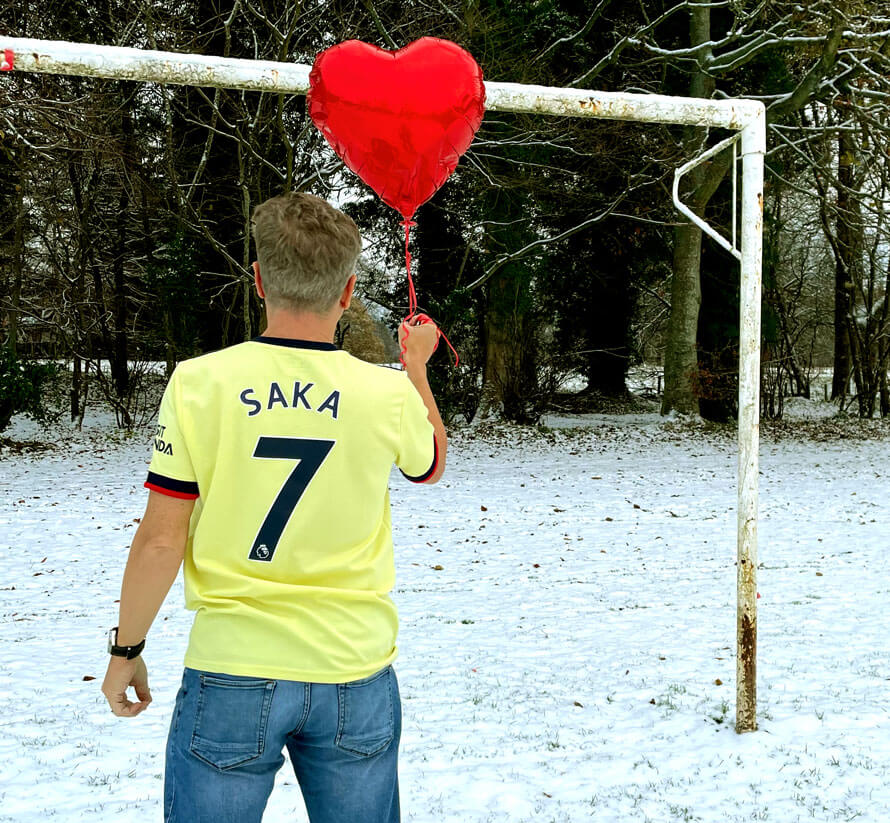 Photo of Peter Cackett wearing football shirt. 
