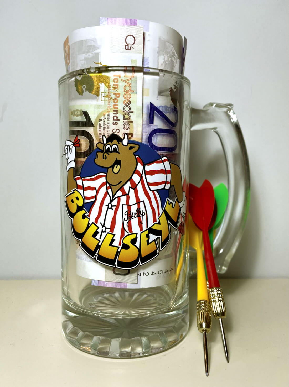 Photo of tv game show Bullseye tankard and darts. 