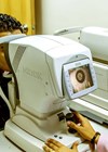 Photo showing Ophthalmic Technician conducting pachymetry.